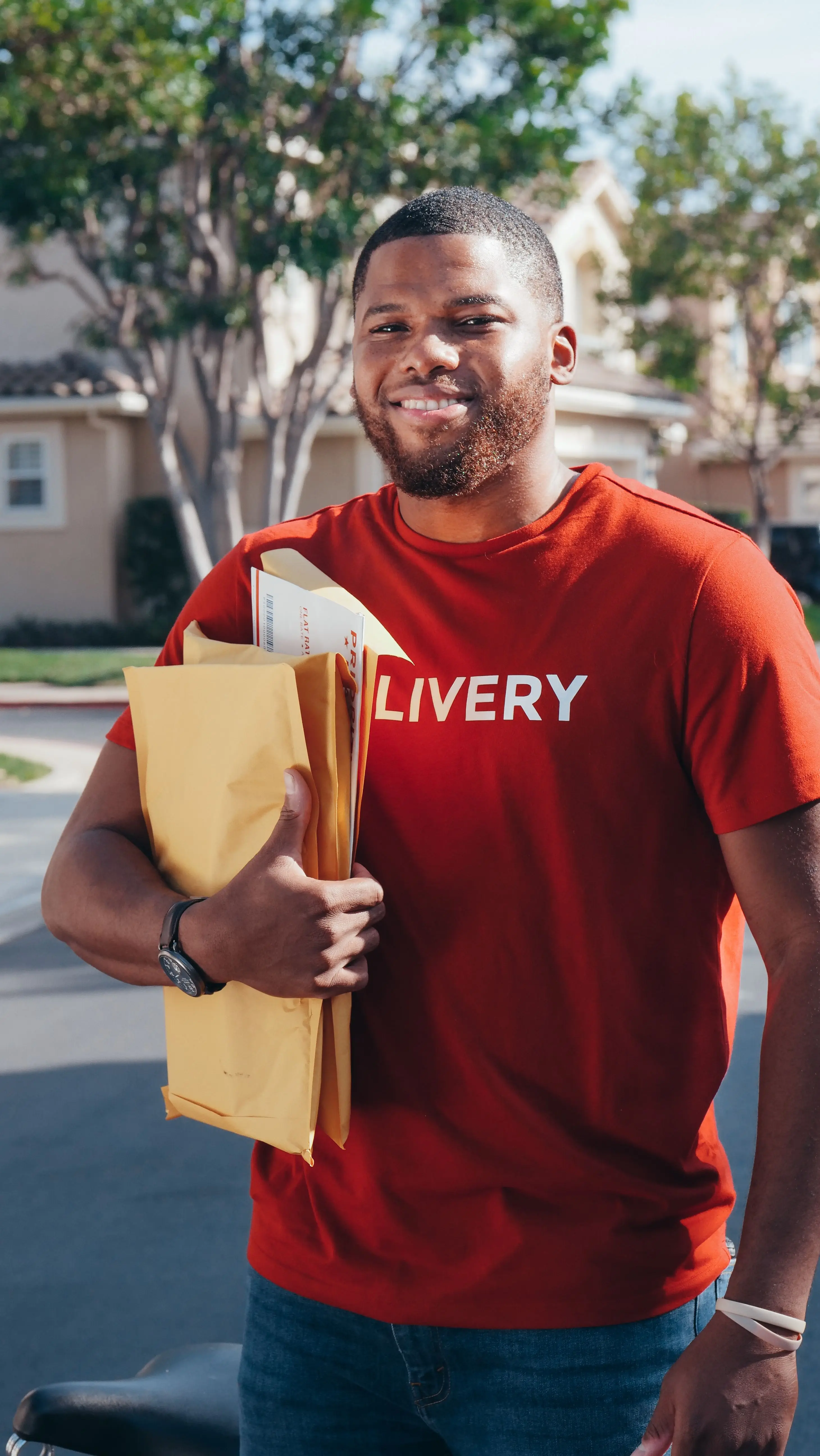 A courier holding sealed document envelopes